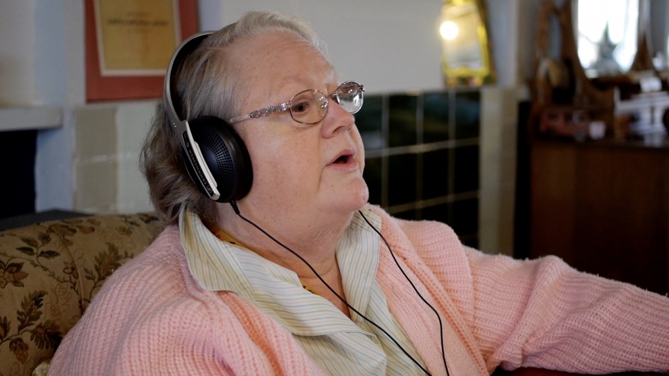 Lady with glasses and headphones