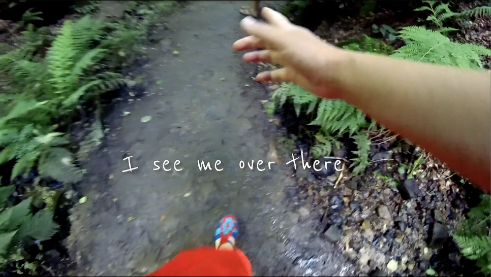 still image of video in shot someones hand and foot pov style
